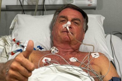 Brazil’s former President Jair Bolsonaro gives a thumb's up from his hospital bed earlier this week.