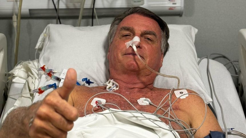 Brazil’s former President Jair Bolsonaro gives a thumb's up from his hospital bed earlier this week.