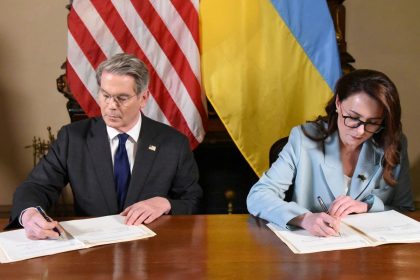 US Treasury Secretary Scott Bessent and Ukrainian Economy Minister Yulia Svyrydenko sign a deal that gives the United States preferential access to Ukraine's mineral resources.