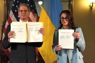 US Treasury Secretary Scott Bessent and Ukraine's First Deputy Prime Minister Yulia Svyrydenko pose after signing the US-Ukraine minerals deals in Washington, DC, on Wednesday.