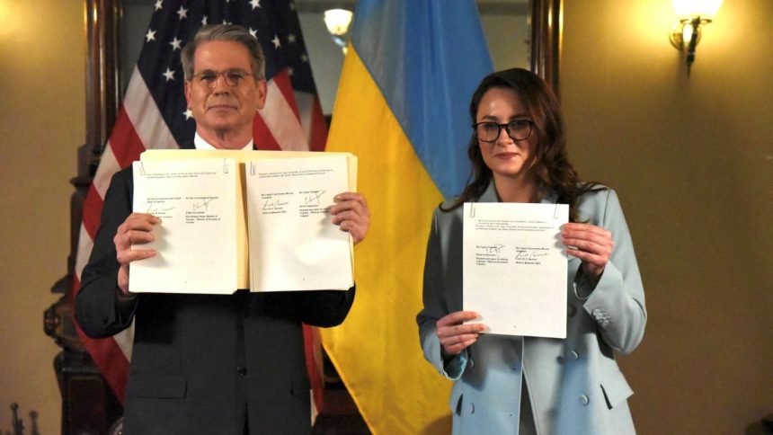 US Treasury Secretary Scott Bessent and Ukraine's First Deputy Prime Minister Yulia Svyrydenko pose after signing the US-Ukraine minerals deals in Washington, DC, on Wednesday.