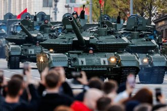 Russian tanks drive along a Moscow street on the day of a rehearsal for a military parade marking the 80th anniversary of victory over Nazi Germany, on May 3, 2025.