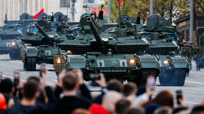 Russian tanks drive along a Moscow street on the day of a rehearsal for a military parade marking the 80th anniversary of victory over Nazi Germany, on May 3, 2025.