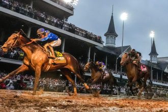 Sovereignty, ridden by jockey Junior Alvarado, crosses the finish line first to win the 151st running of the Kentucky Derby at Churchill Downs.