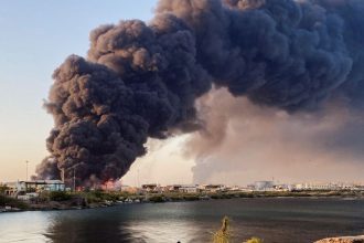 A large plume of smoke rises from a fuel depot in Port Sudan, Sudan, on May 6, 2025.