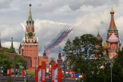 Russia's Su-25 jet aircraft release smoke in the colours of the Russian state flag while flying towards the Kremlin and St. Basil’s Cathedral during a rehearsal in Moscow on Wednesday for the May 9 parade.
