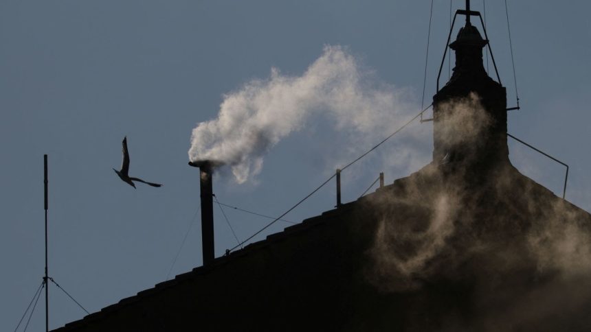 White smoke rises from the chimney on the Sistine Chapel, indicating that a new pope has been elected at the Vatican, May 8, 2025.