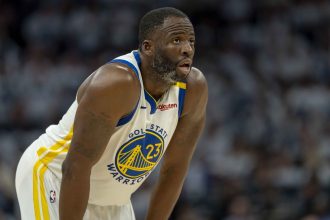 Golden State Warriors forward Draymond Green looks on against the Minnesota Timberwolves in the second half during Game 2 of the second round of the NBA playoffs at Target Center.