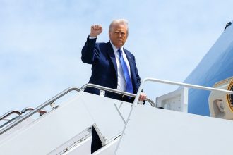US President Donald Trump gestures as he boards Air Force One, departing for Saudi Arabia, Qatar and the United Arab Emirates, at Joint Base Andrews, in Maryland, US on Monday.