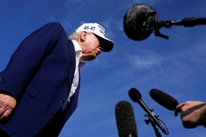 President Donald Trump speaks to the media before boarding Air Force One.