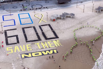 Israeli protesters display the words "SAVE THEM NOW", the number 600 for the number of days since hostages were kidnapped from Israel by Hamas, and the number 58 for the number of hostages still in Gaza, at the shore of the Mediterranean, opposite the US Consulate in Tel Aviv, Israel, on Wednesday.
