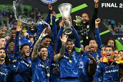 Chelsea's Reece James lifts the trophy after winning the Conference League.