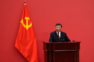 Chinese Leader Xi Jinping speaks at an event to introduce new members of the Politburo Standing Committee at the Great Hall of the People in Beijing, Sunday, Oct. 23, 2022.