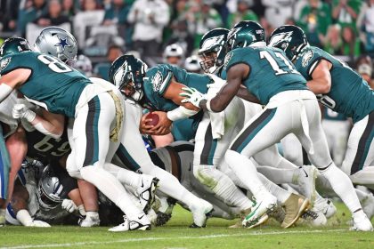 Nov 5, 2023; Philadelphia, Pennsylvania, USA; Philadelphia Eagles quarterback Jalen Hurts (1) picks up yardage a first down with a push from wide receiver A.J. Brown (11) and tight end Dallas Goedert (88) against the Dallas Cowboys at Lincoln Financial Field. Mandatory Credit: Eric Hartline-USA TODAY Sports