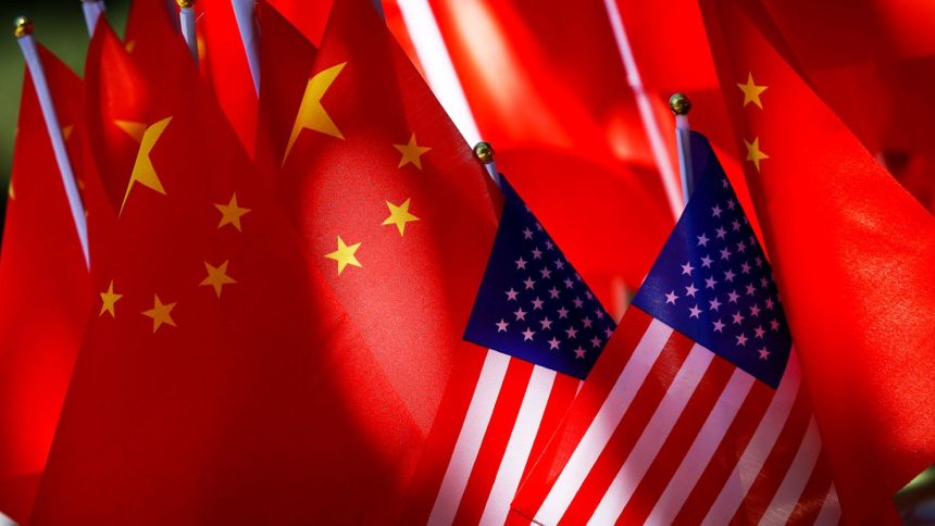 American flags are displayed together with Chinese flags on top of a trishaw in Beijing.