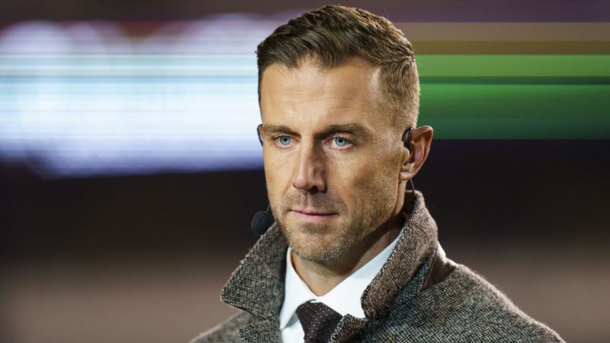 Former NFL quarterback Alex Smith looks on during an NFL game in 2022.