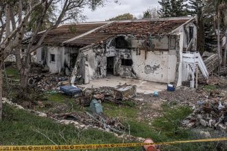 The ruins of a house stand in kibbutz Be'eri, one of the communities hit hardest in the October 7, 2023 attacks.