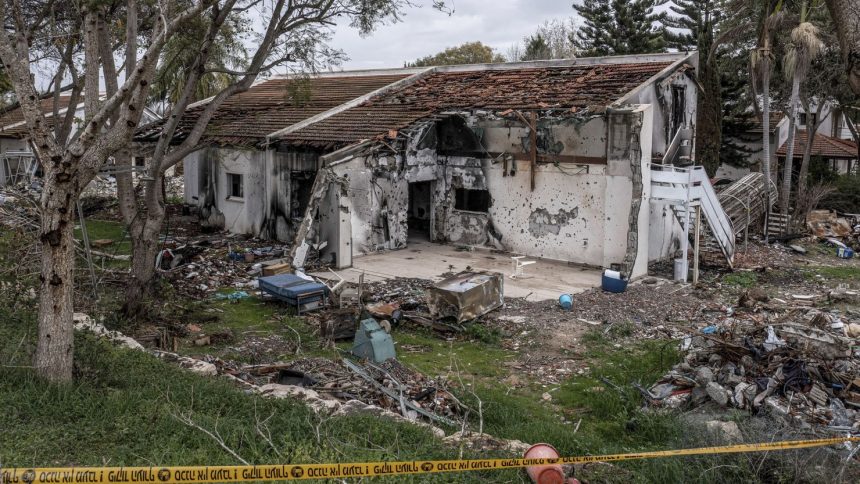 The ruins of a house stand in kibbutz Be'eri, one of the communities hit hardest in the October 7, 2023 attacks.