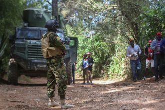 FILE - A Kenyan police officer patrols an area in the Kenscoff neighborhood of Port-au-Prince, Haiti, on Feb. 13, 2025.
