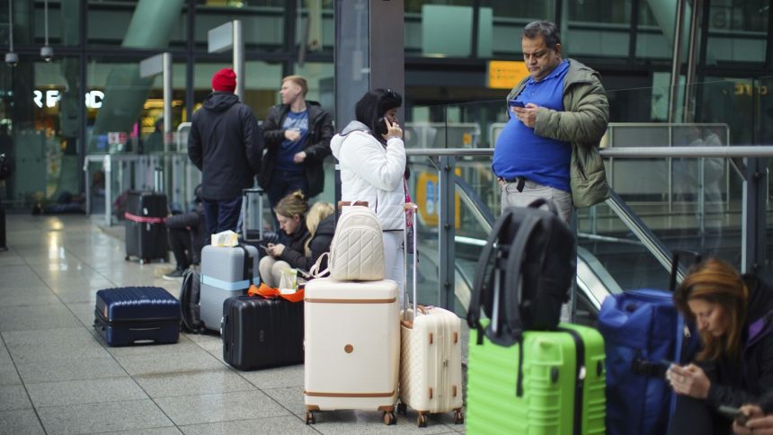 Stranded passengers at Heathrow Terminal 5 in London on Friday.