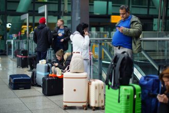 Stranded passengers at Heathrow Terminal 5 in London. More than 1,300 flights to and from Heathrow Airport will be disrupted on Friday due to the closure of the airport following a fire at the North Hyde electrical substation last night. Picture date: Friday March 21, 2025.