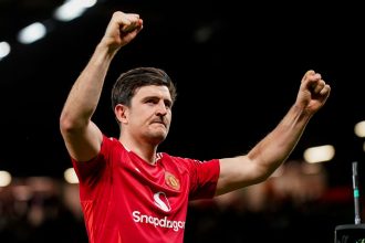 Harry Maguire celebrates after the tie against Olympique Lyon at Old Trafford on April 17.