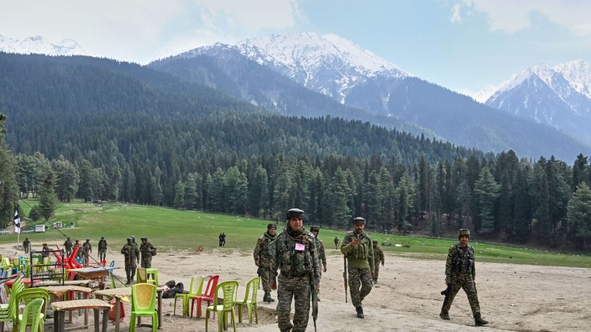 Indian security officers inspect the site where militants opened fired at tourists in Pahalgam, Indian controlled Kashmir, on April 23, 2025.