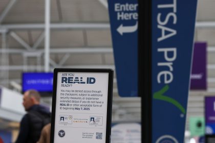 A sign outside a TSA checkpoint at Chicago O'Hare International Airport informs travelers of the REAL ID deadline.