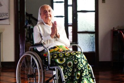 Sister Inah Canabarro Lucas, pictured in February 2024, puts her hands together in prayer.