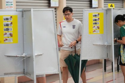 Singaporean voters cast their vote for general election at polling station in Singapore on May 3, 2025.