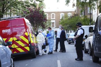 Forensics officers are seen in Kentish Town, north London where police are investigating a fire at Keir Starmer's private house.