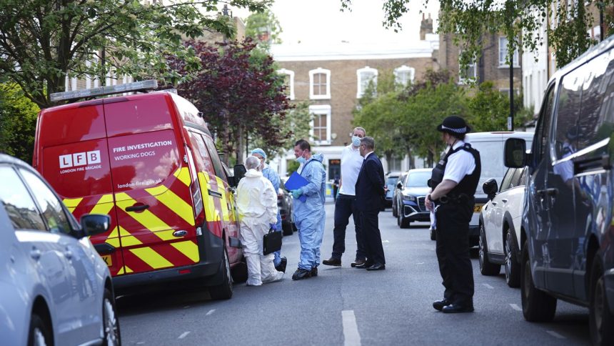 Forensics officers are seen in Kentish Town, north London where police are investigating a fire at Keir Starmer's private house.
