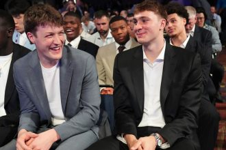 Duke's Kon Knueppel, left, and Cooper Flagg, right, smile at the NBA draft lottery in Chicago on Monday.