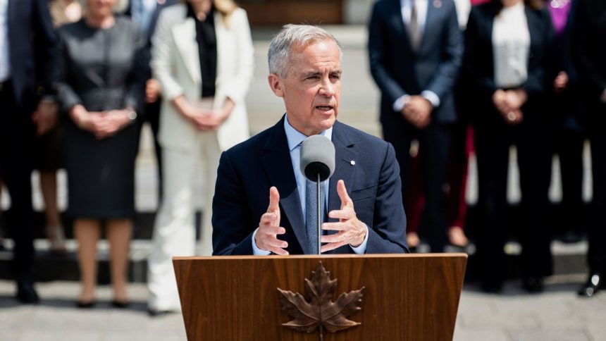 Canadian Prime Minister Mark Carney speaks to reporters following his cabinet's swearing-in ceremony at Rideau Hall in Ottawa on Tuesday.