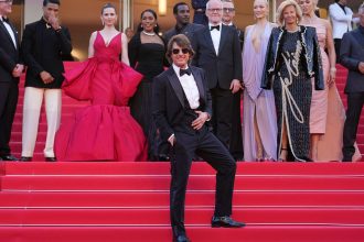 Tom Cruise, front, with other cast members from 'Mission: Impossible - The Final Reckoning' at the Cannes Film Festival on May 14, 2025.