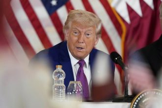 US President Donald Trump gestures during a business roundtable in Doha, Qatar on Thursday.