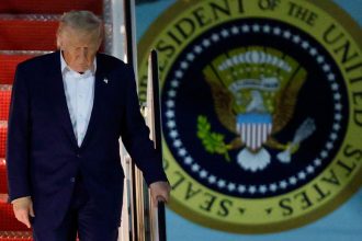 President Donald Trump walks down the stairs of Air Force One upon his arrival at Joint Base Andrews, Maryland, on May 16, 2025.