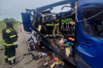 Rescuers recover the bodies of passengers after a Russian drone struck a bus in the Sumy region.
