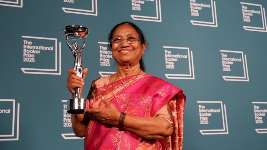 Banu Mushtaq, author of 'Heart Lamp' holds the trophy after winning the International Booker Prize, in London