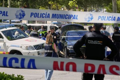 Police officers cordon off the area outside The American School of Madrid shortly after the former senior aide to ex-Ukrainian president Viktor Yanukovych was shot.