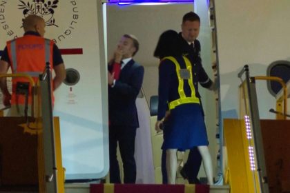 In this grab taken from video, France's President Emmanuel Macron prepares to disembark a plane on arrival, in Hanoi, Vietnam, Sunday, May 25, 2025. (AP Photo/Hau Dinh)