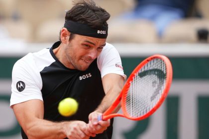 Fritz plays a backhand during his French Open defeat against Daniel Altmaier.