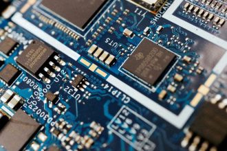 Semiconductor chips are seen on a circuit board of a computer on February 25, 2022.