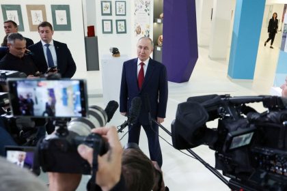 In this photo provided by Russian state-owned news agency Sputnik, Russian President Vladimir Putin meets with journalists following a phone call with US President Donald Trump at the Sirius educational centre for gifted children near Sochi in the Krasnodar region of Russia on May 19.