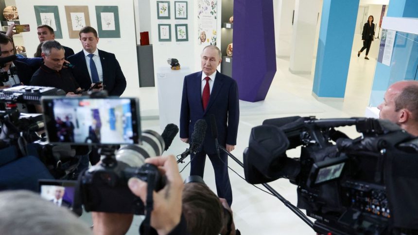 In this photo provided by Russian state-owned news agency Sputnik, Russian President Vladimir Putin meets with journalists following a phone call with US President Donald Trump at the Sirius educational centre for gifted children near Sochi in the Krasnodar region of Russia on May 19.