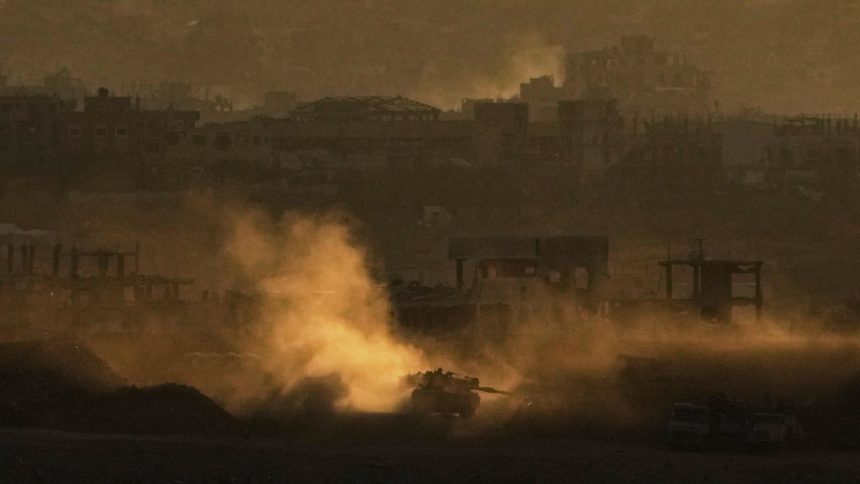 An Israeli army tank maneuvers in the Gaza Strip is seen from southern Israel on May 4.