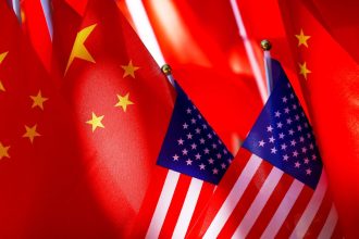 American flags are displayed together with Chinese flags in 2018 in Beijing.