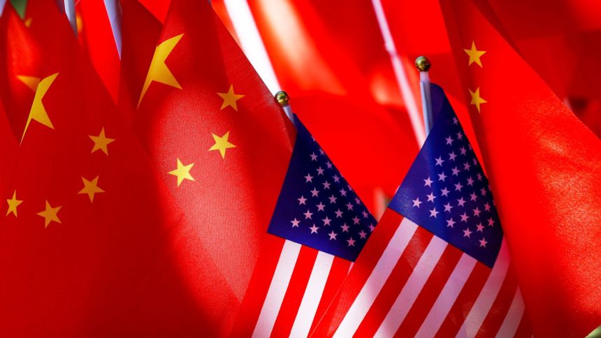 American flags are displayed together with Chinese flags in 2018 in Beijing.