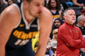 Head coach Michael Malone of the Denver Nuggets watches Nikola Jokic and teammates as they take on the Orlando Magic during the third quarter at Ball Arena in Denver, Colorado, on February 6.