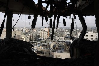 A picture shows a view from an apartment in a residential building that was hit in Israeli strikes in Gaza City's Yarmuk street on April 24.